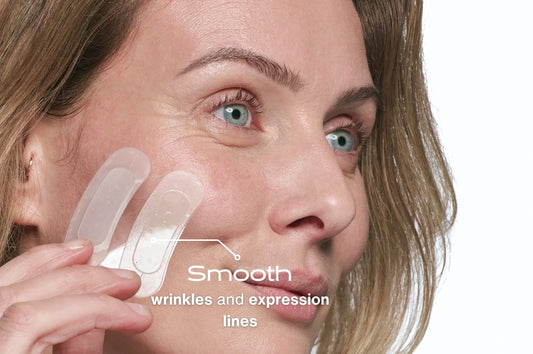 Woman applying a skincare product with text 'Smooth wrinkles and expression lines' on a white background